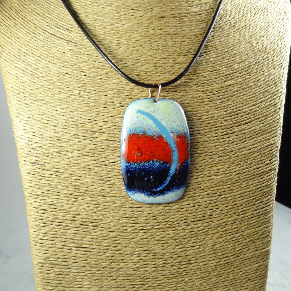 Handcrafted ivory red and blue glass enamelled copper 51x34mm pendant, on an 18 inch black leather cord with lobster clasp (#0079)