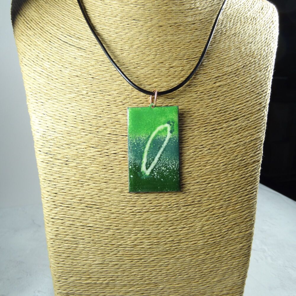 Handcrafted green glass enamelled copper rectangular shaped 47x29mm pendant, on an 18 inch black leather cord with lobster clasp (#0117)