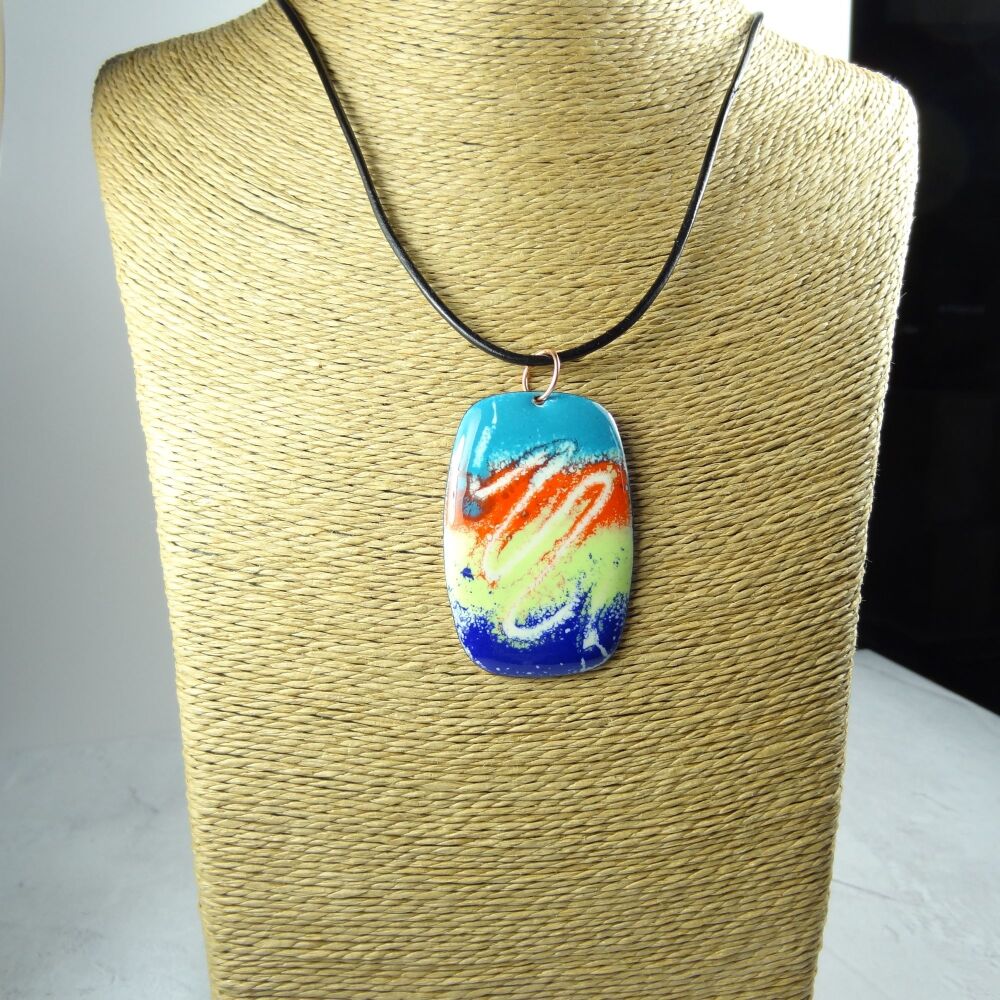 Handcrafted blue orange yellow dark blue glass enamelled copper 51x34mm pendant, on an 18 inch black leather cord with lobster clasp (#0078)