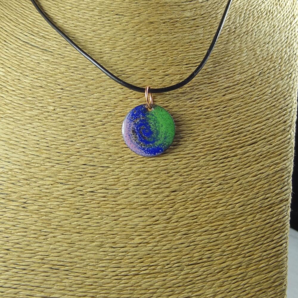 Handcrafted pink blue green glass enamelled copper 22mm disc pendant, on an 18 inch black leather cord with lobster clasp (#0106)