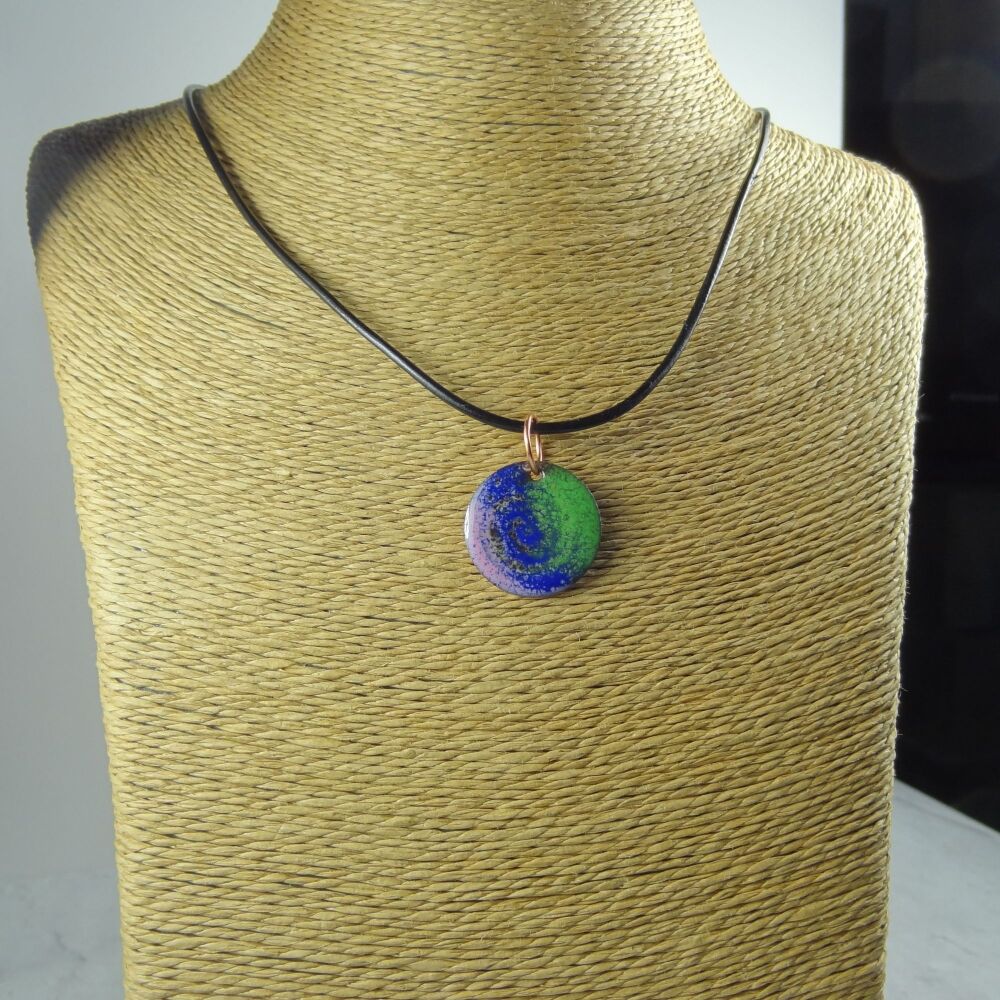 Handcrafted pink blue green glass enamelled copper 22mm disc pendant, on an 18 inch black leather cord with lobster clasp (#0106)