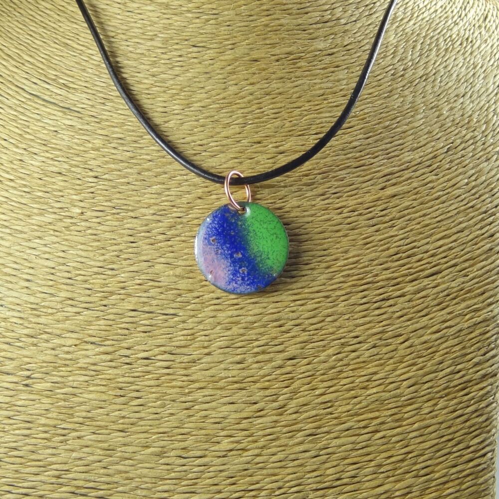 Handcrafted green blue and pink glass enamelled copper 22mm disc pendant, on an 18 inch black leather cord with lobster clasp (#0111)