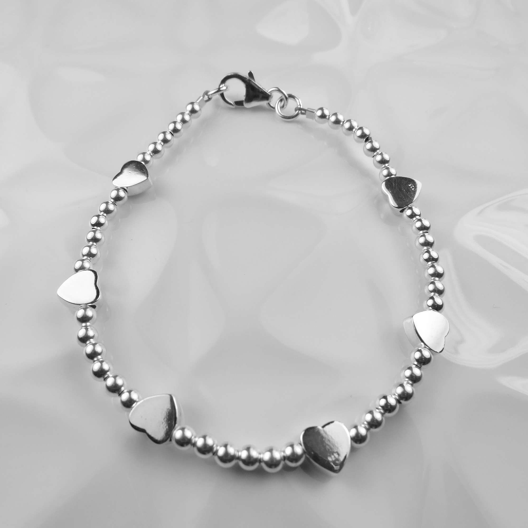 Sterling silver puffed heart hoop earrings