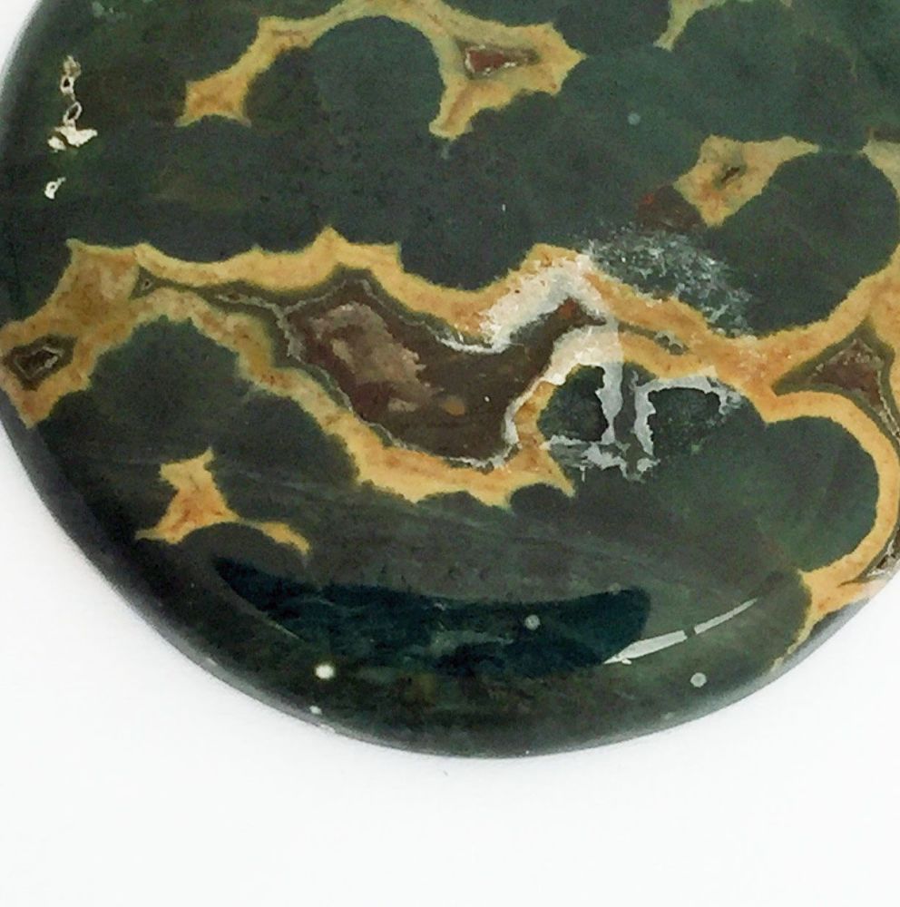 Damaged coating on a gemstone