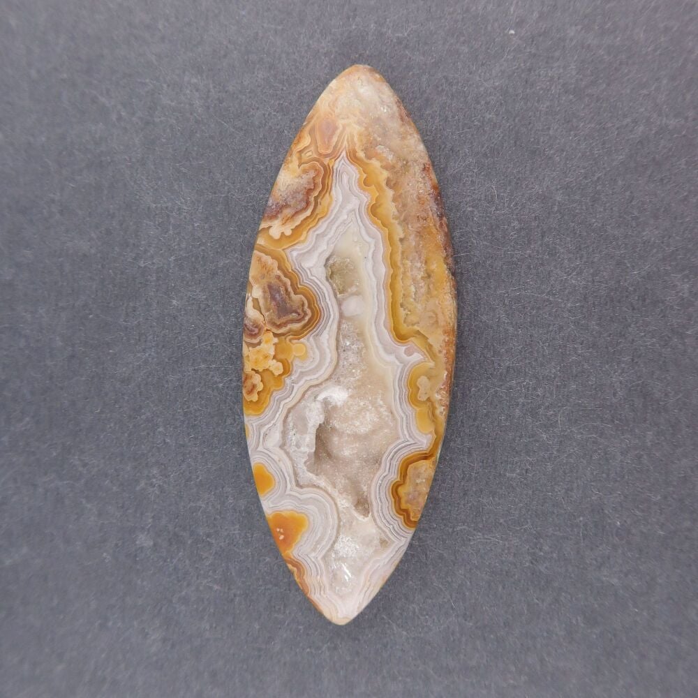 Crazy lace agate cabochon with druzy