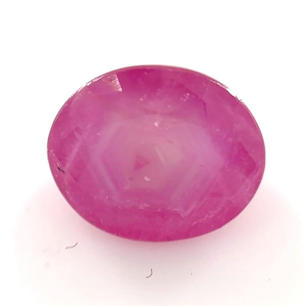 Sapphire faceted pink sheen with growth zone pattern