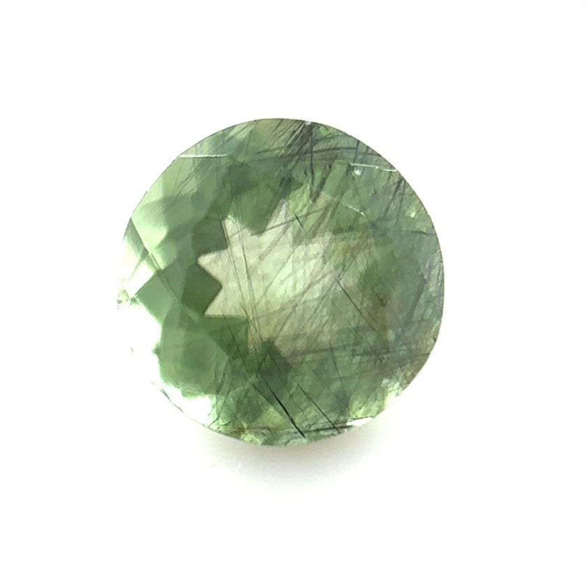 Peridot faceted gem with Ludwigite inclusions - 4527