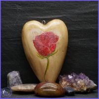 Red Rose on Wooden Heart.
