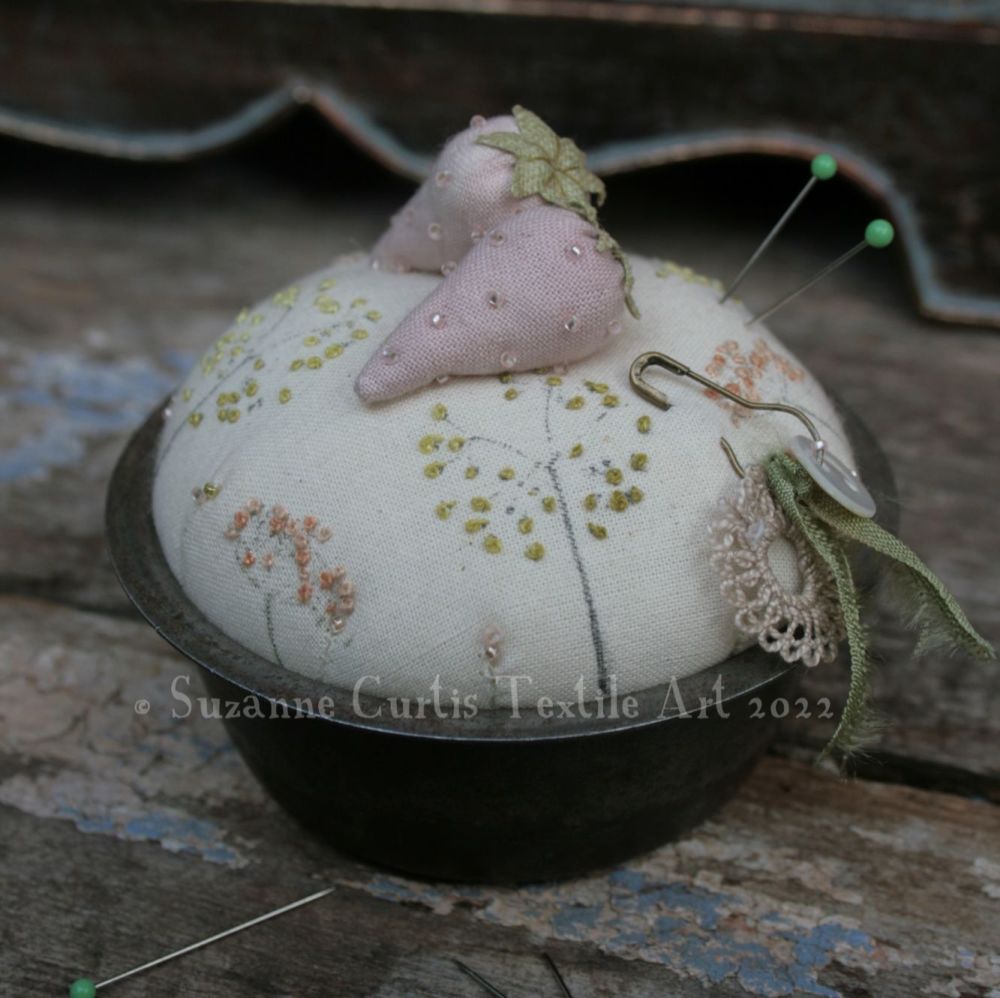 A vintage tin pincushion with berries - M