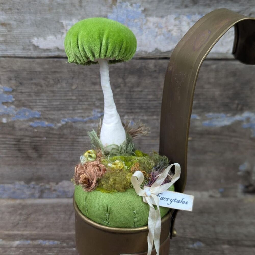 Green Velvet Toadstool in a Vintage Brass Measure.
