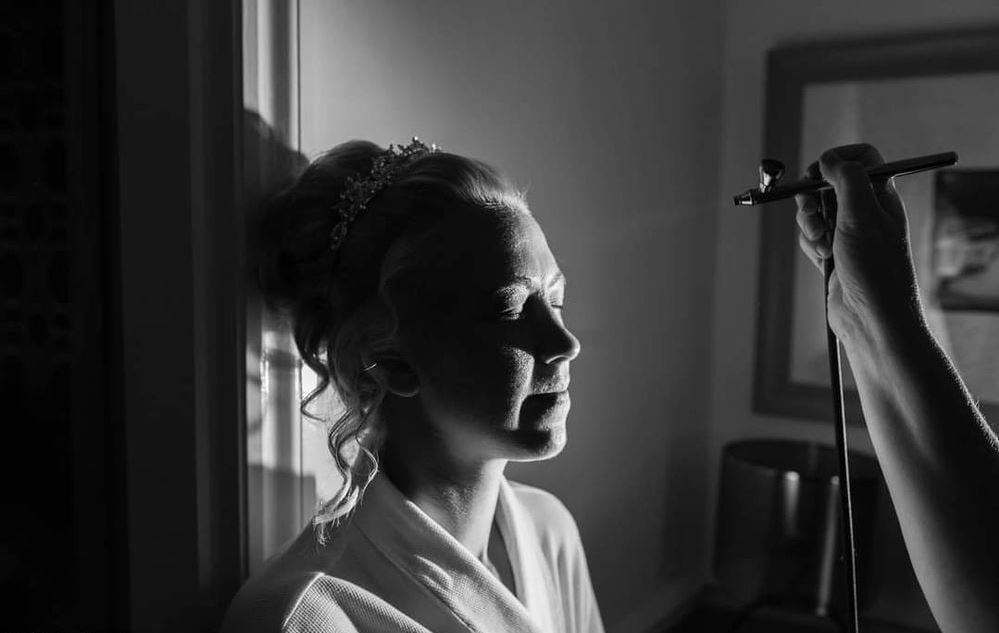 aIRBRUSHING A BRIDE ON HER WEDDING MORNING