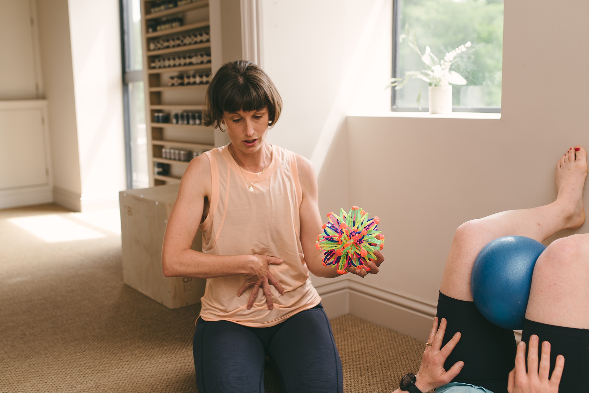 Female mum lifting kid with pelvic organ prolapse