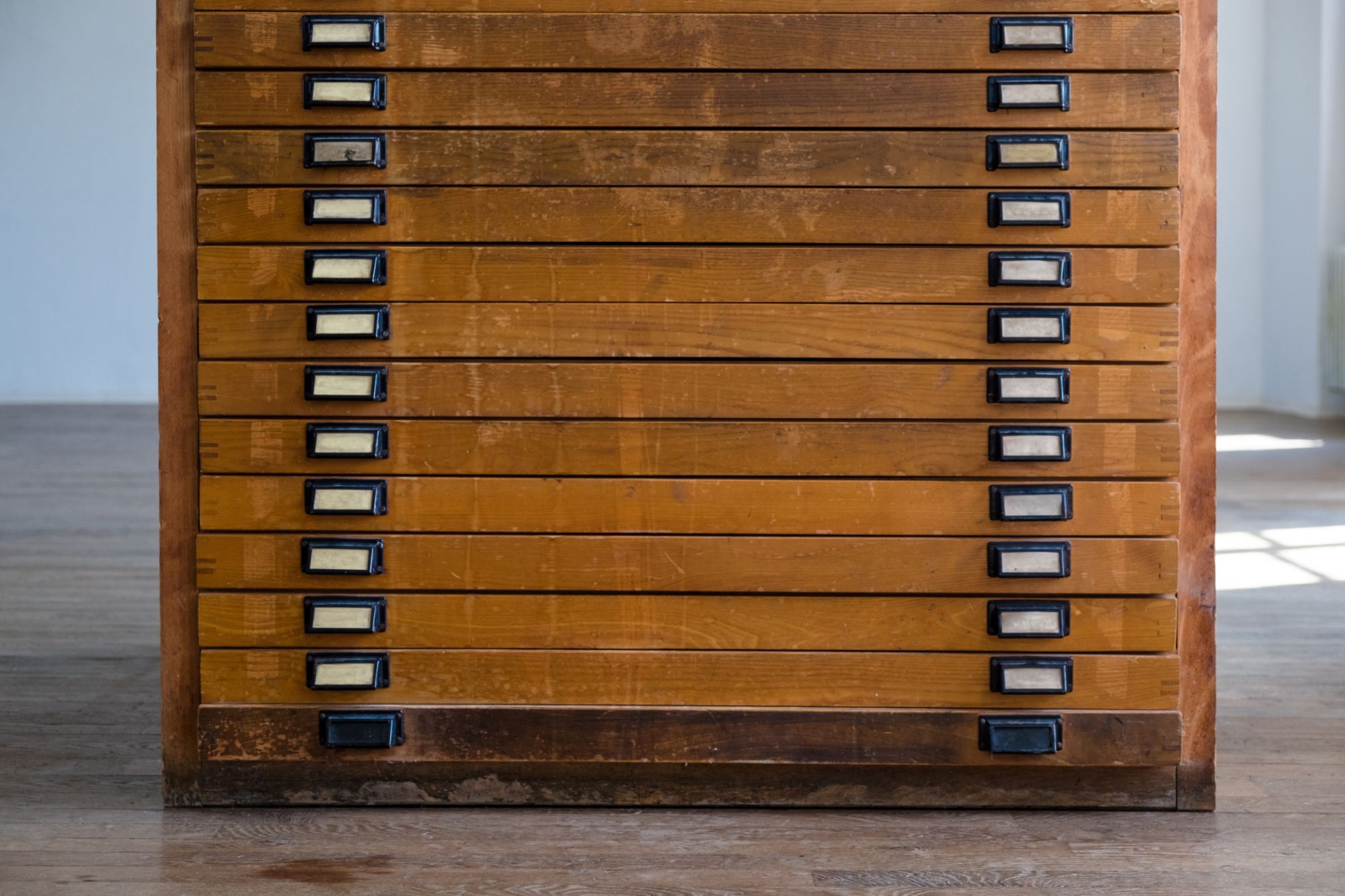 A wooden plan chest for storing collections flat