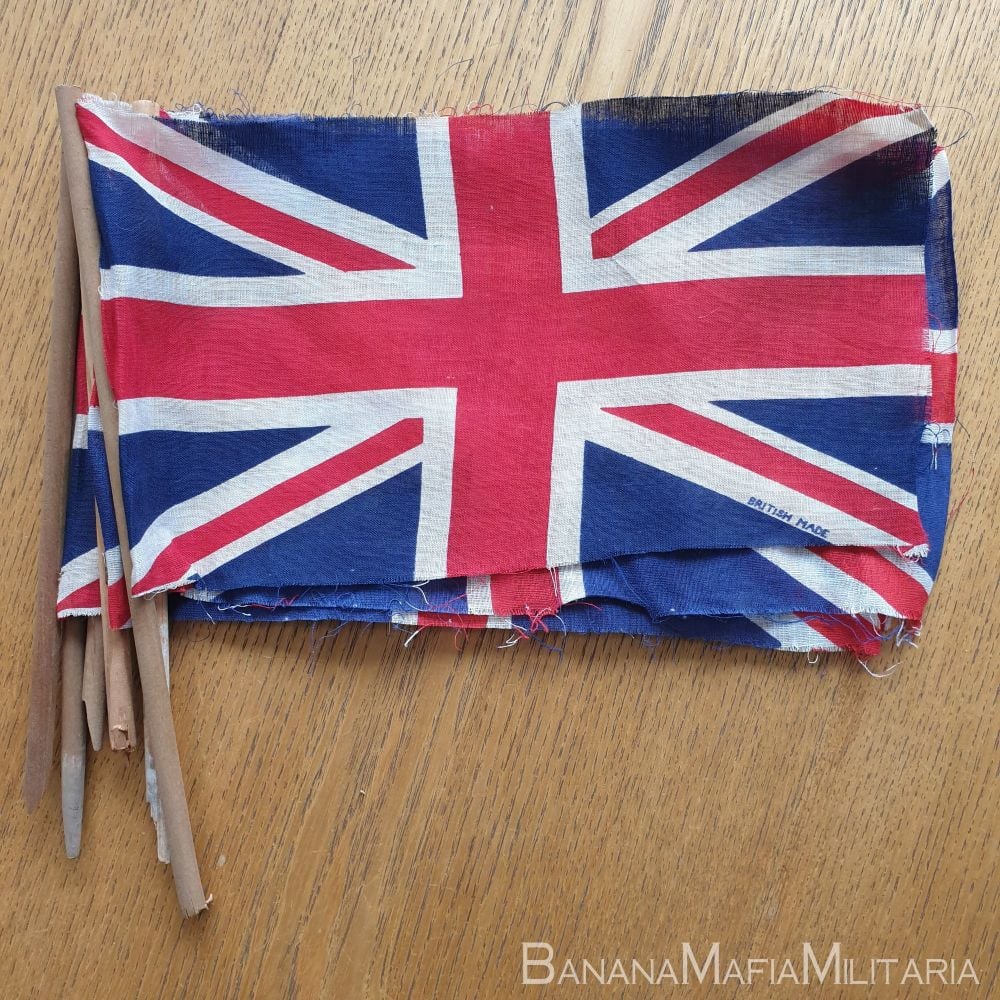 VE day flags (on broken hand held pole) printed and marked British made.