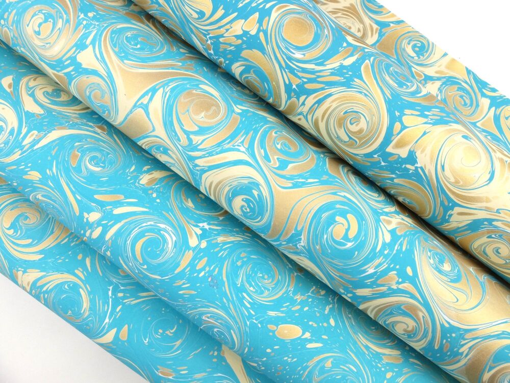 Turquoise, cream, and gold French curl pattern marbled A2 paper design
