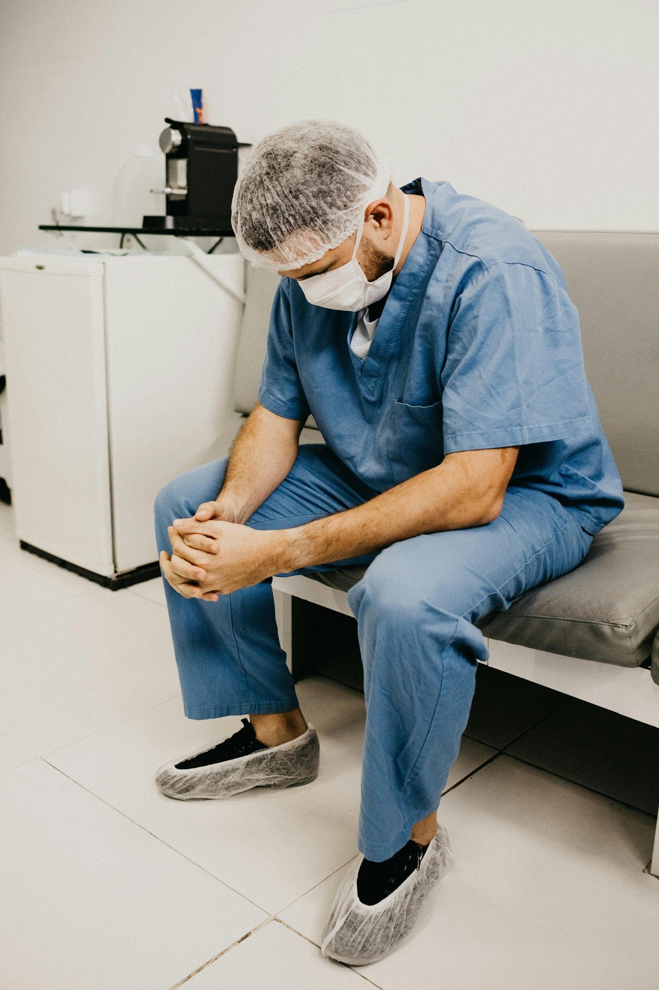 Image of tired looking healthcare worker
