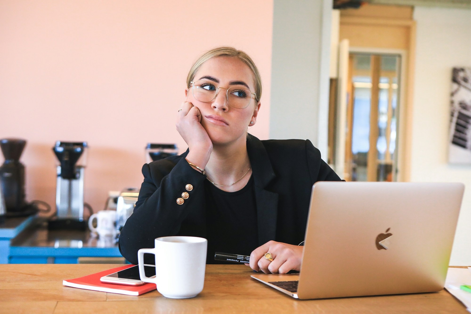 Woman at desk looking resentful