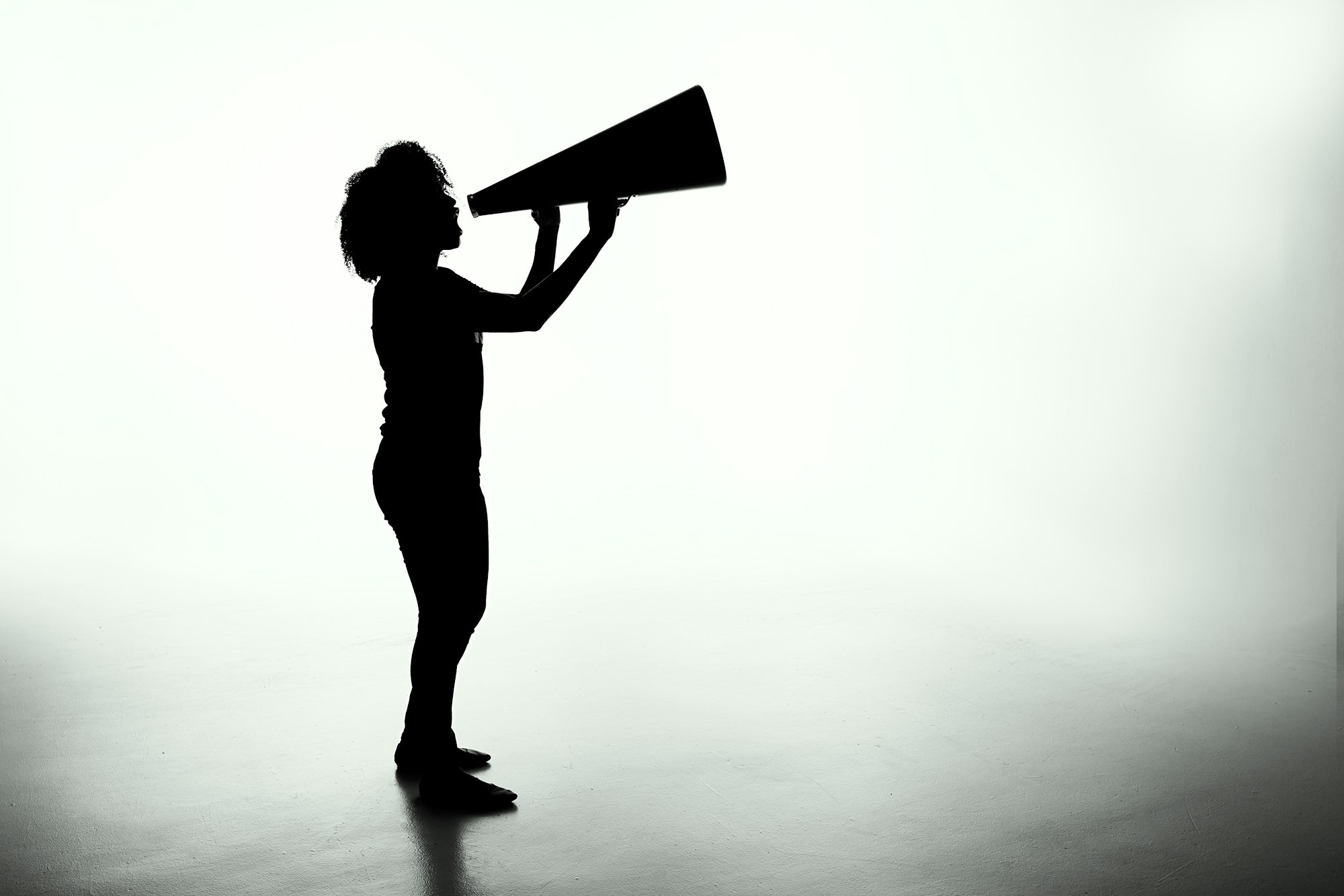 woman shouting into megaphone