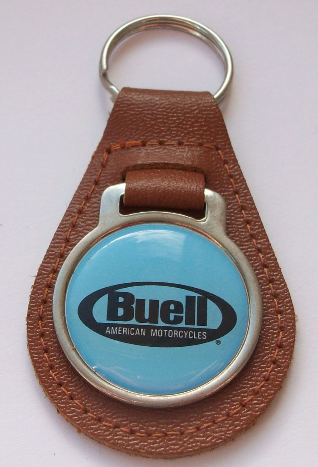 Buell acrylic badged tan leather keyring.