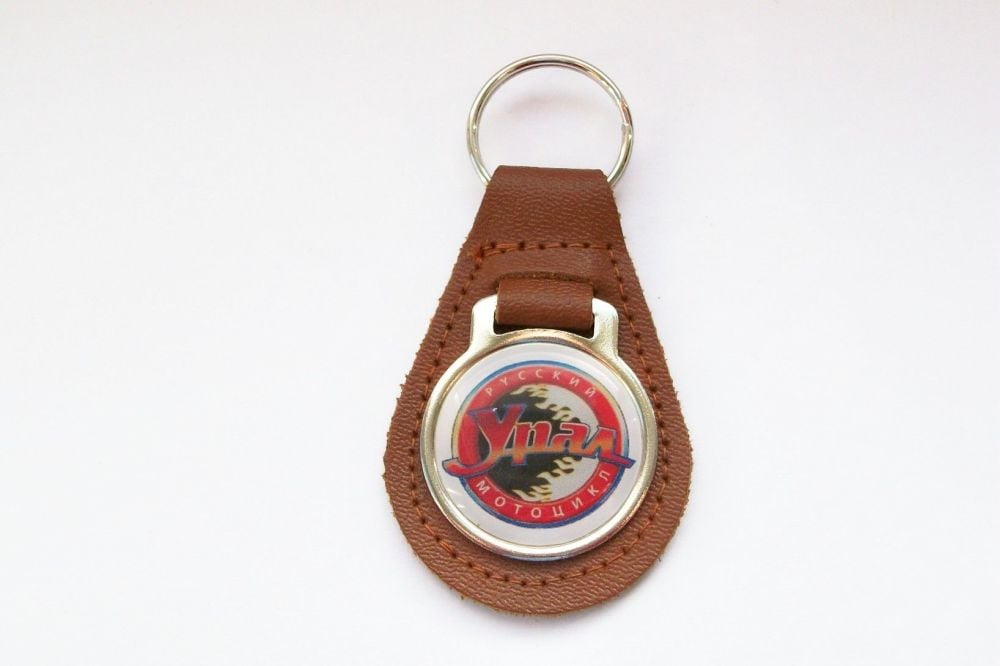 Ural acrylic badged tan leather keyring..