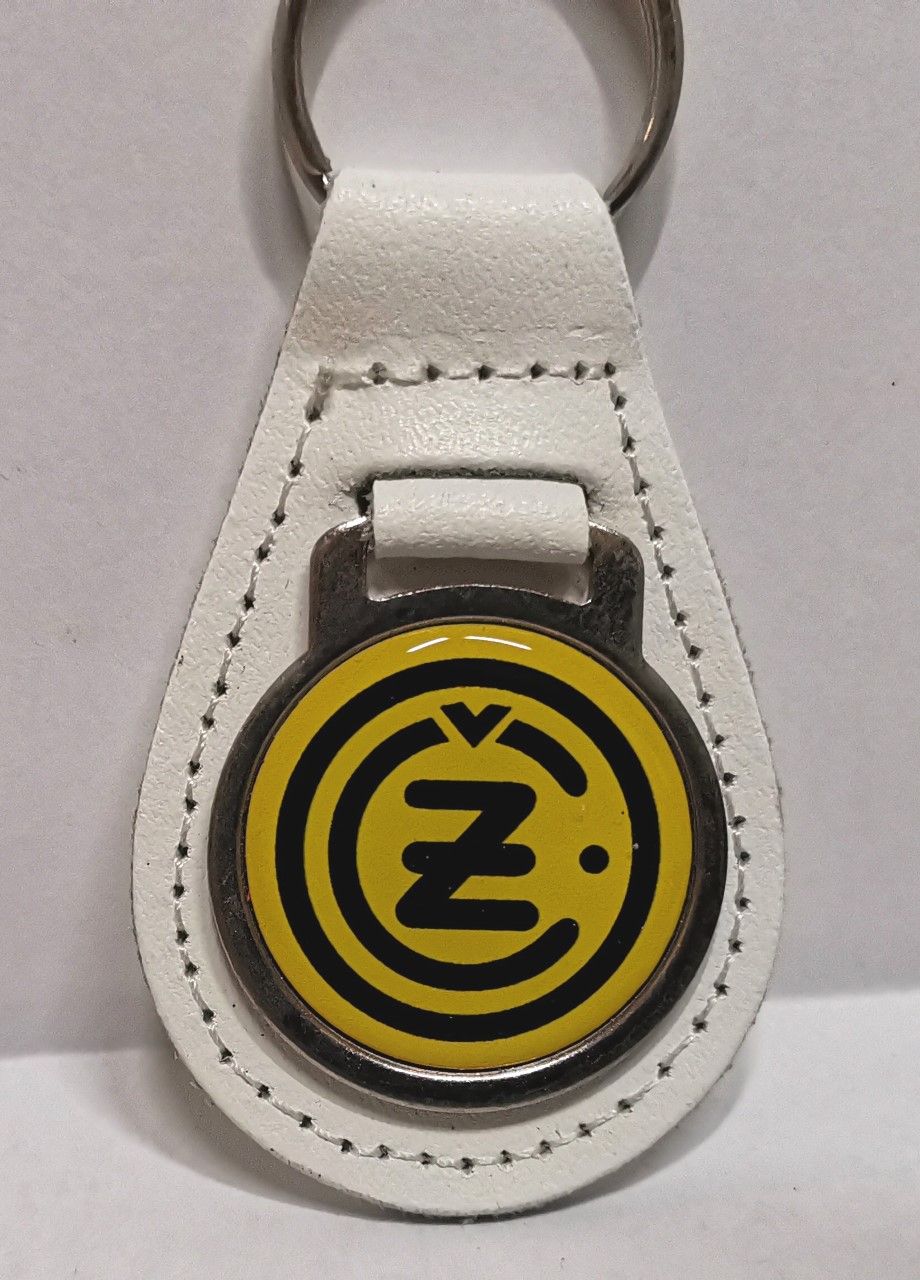 CZ acrylic badged white leather keyring.