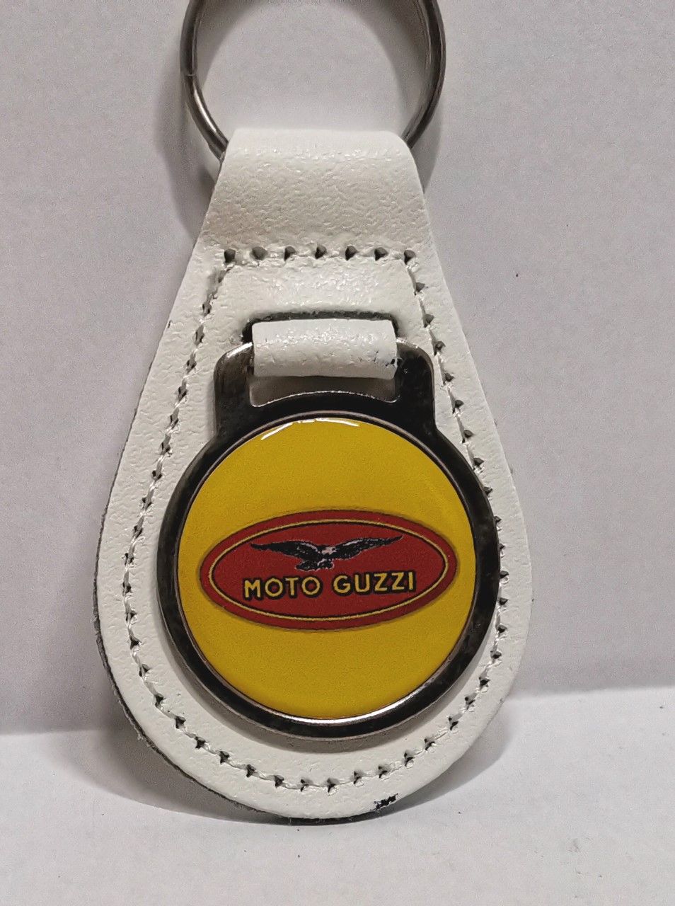 Moto Guzzi acrylic badged white leather keyring.