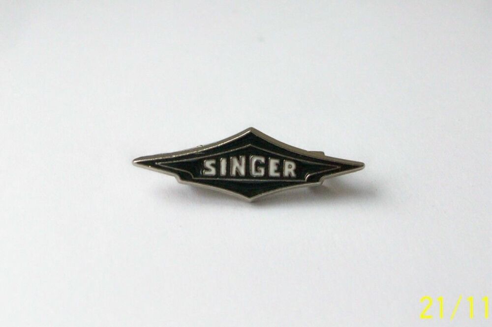 Singer lapel pin badge
