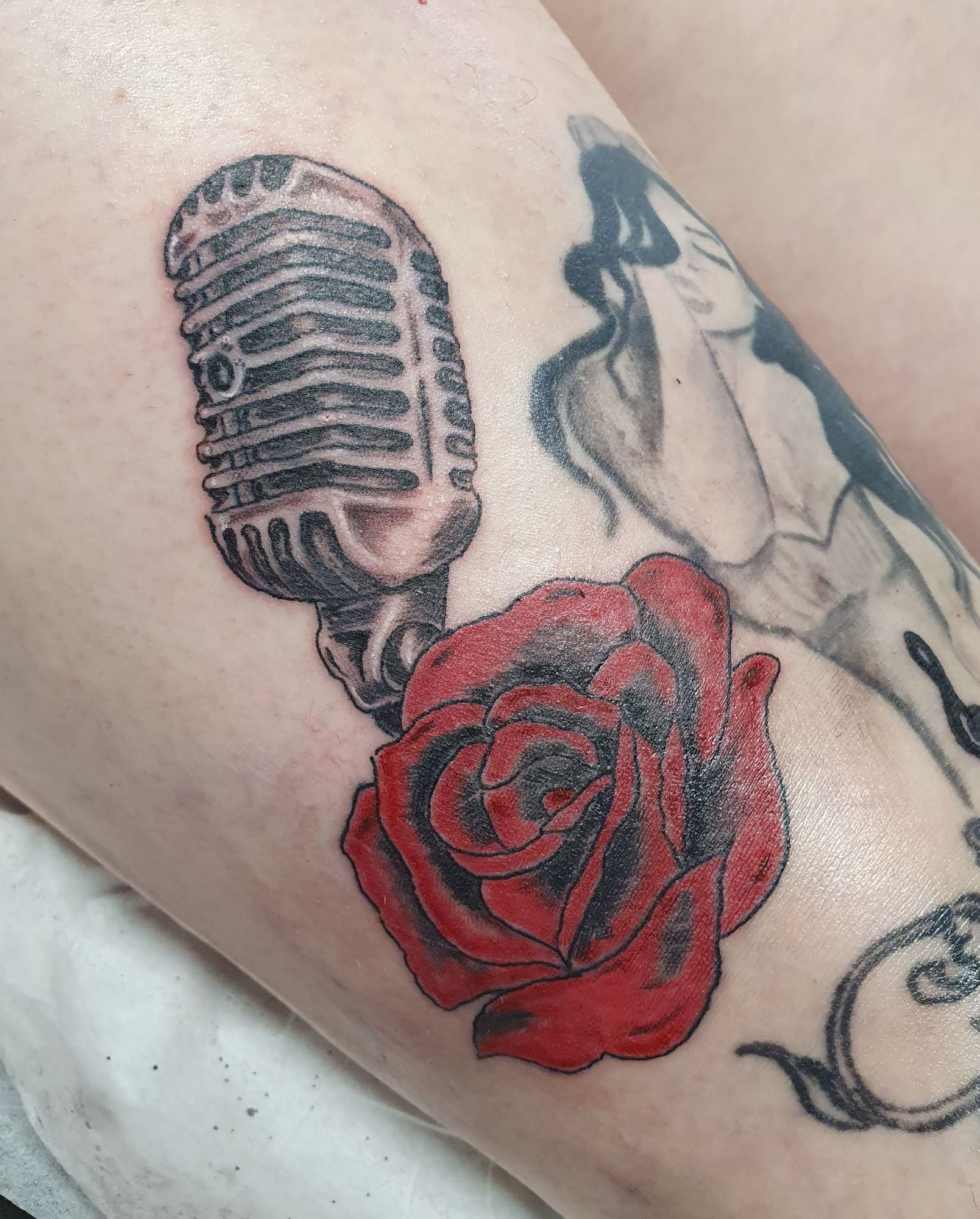 microphone and rose tattoo