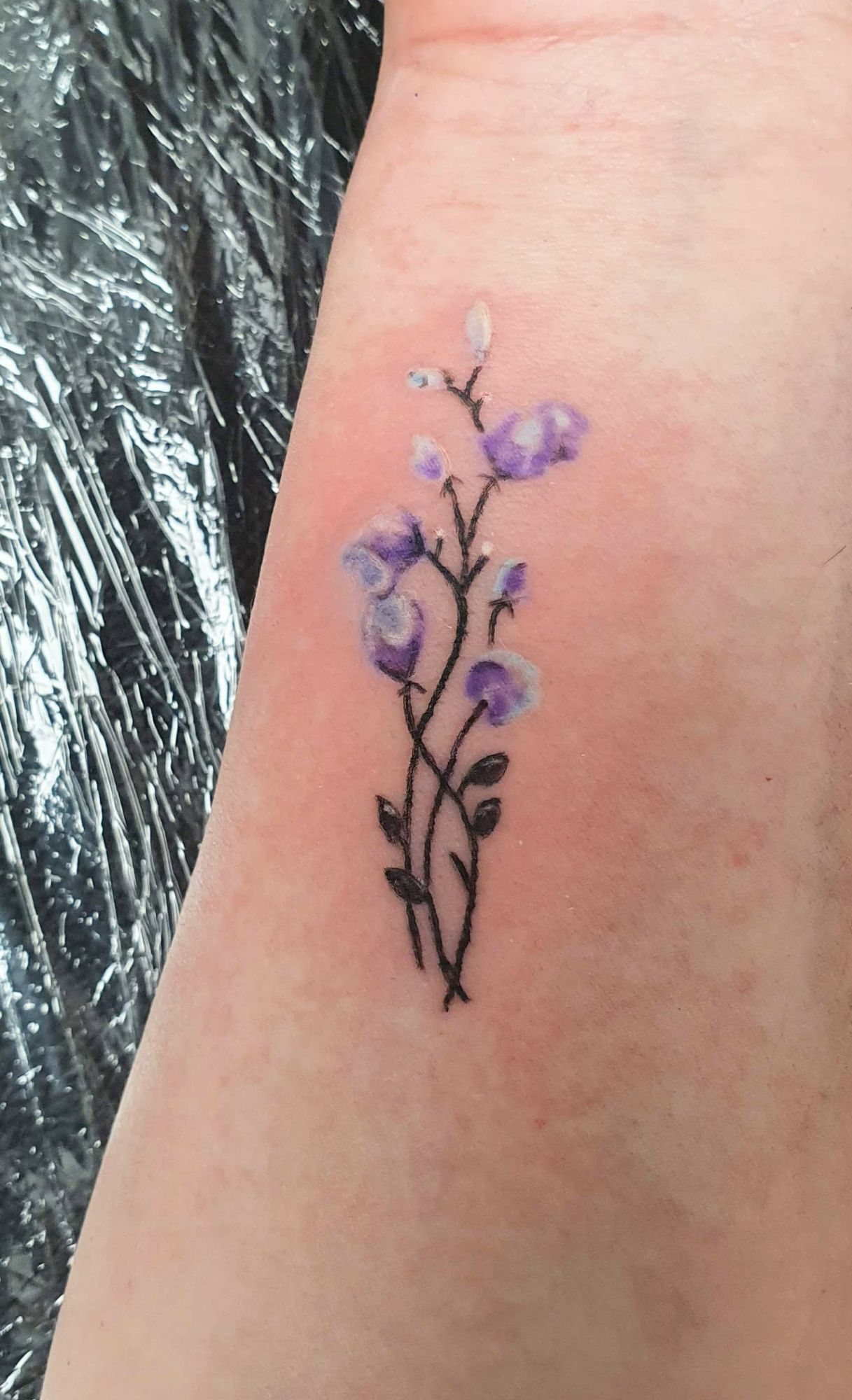 watercolour flower wrist tattoo