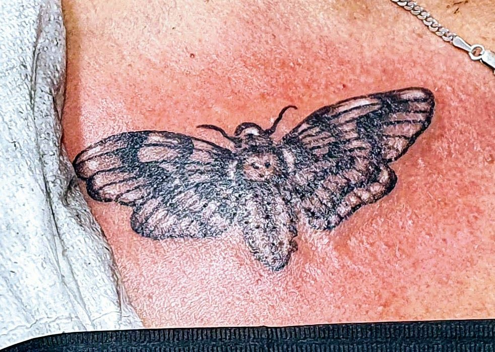 Death moth tattoo