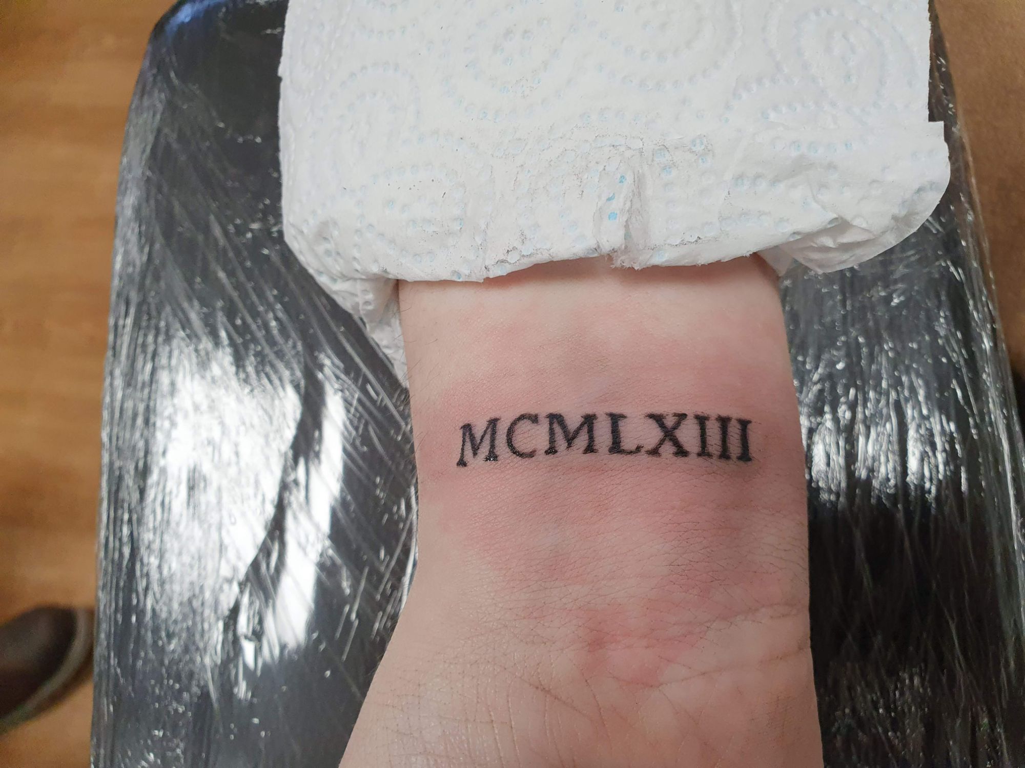 roman numeral memorable date tattoo