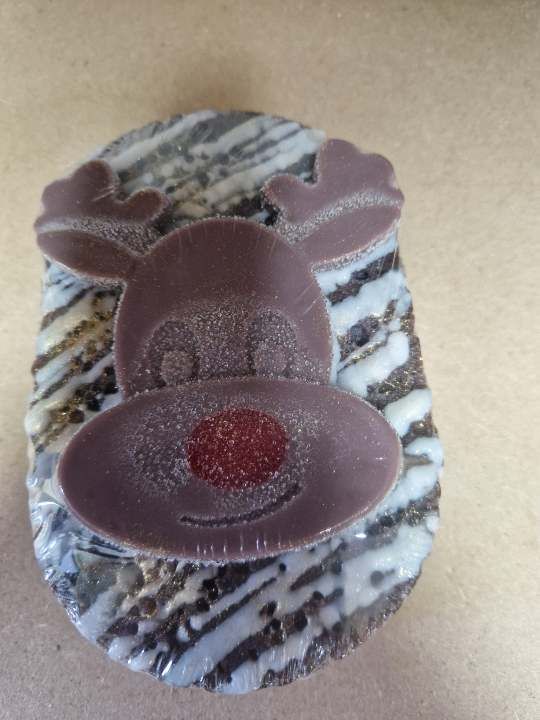 Reindeer soap sponge with soap on top.