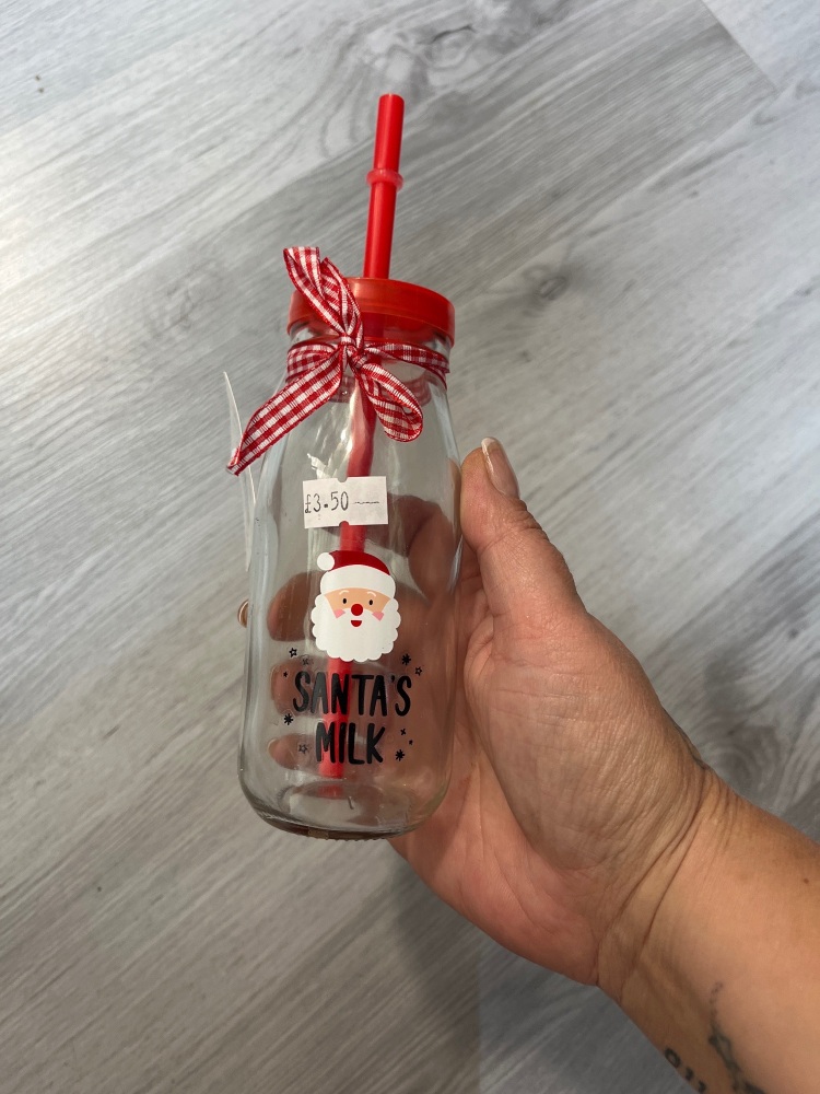 Santas milk , bottle and straw