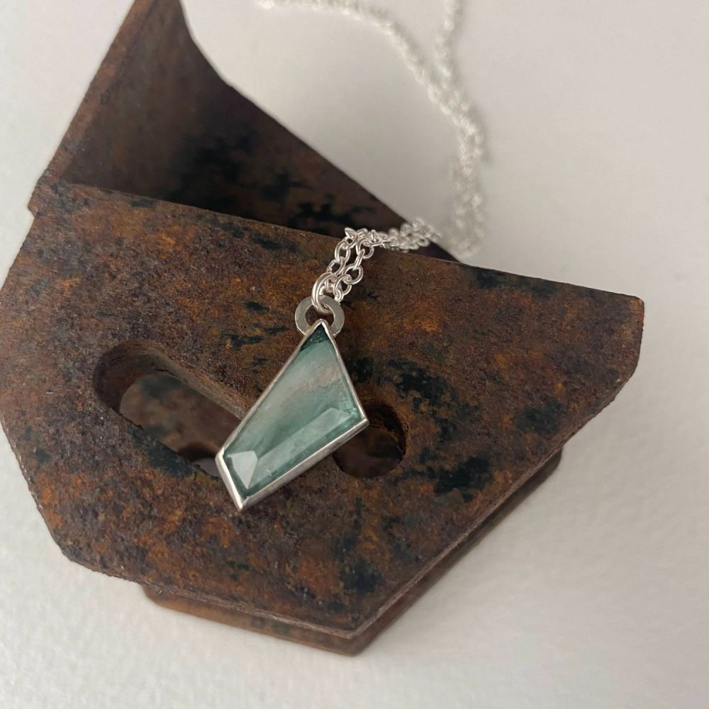 Asymmetric  tourmaline set in a silver Pendant