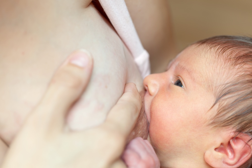 newborn-baby-sucks-breast