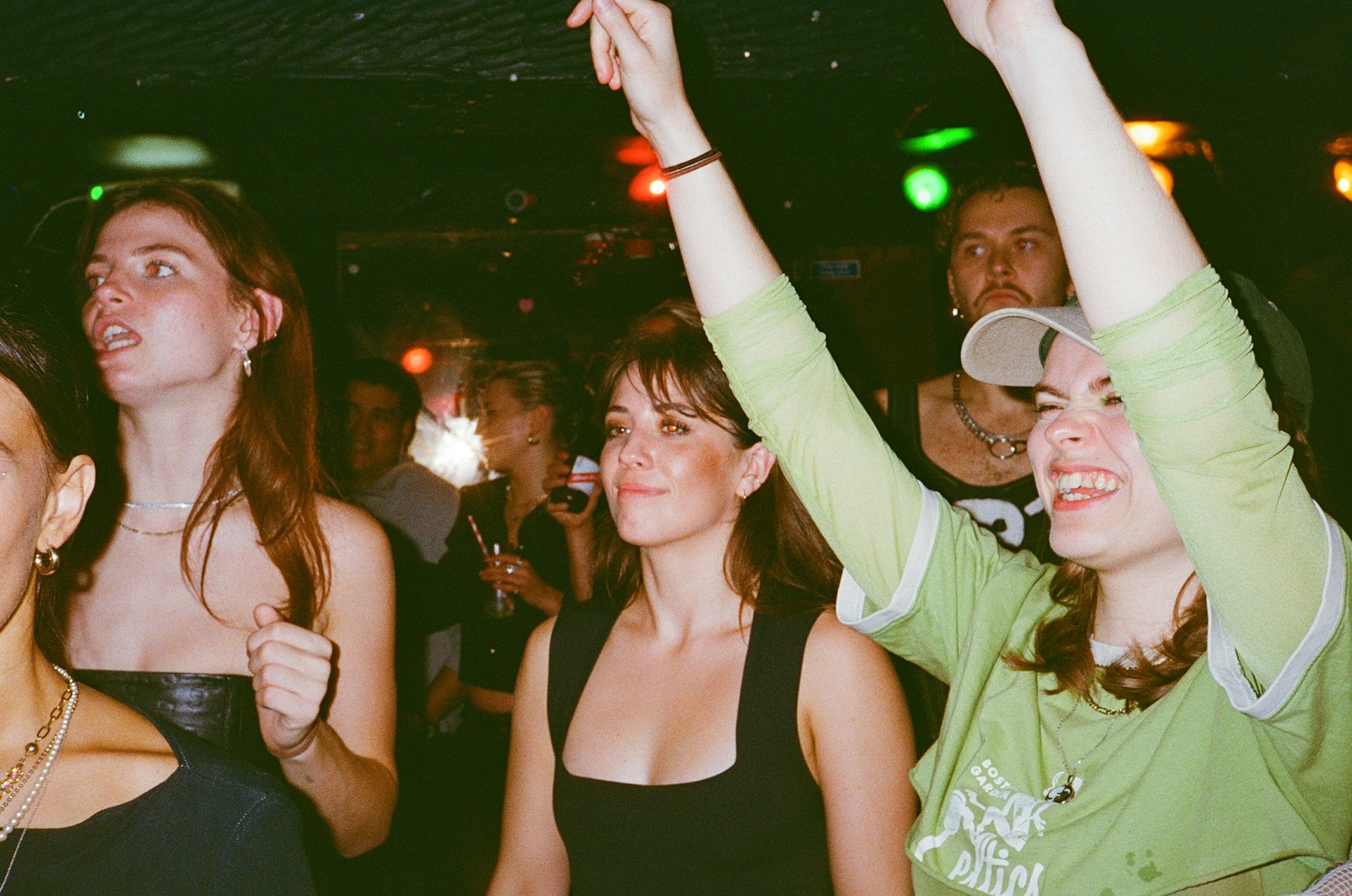 a-group-of-people-standing-around-each-other-at-a-party-dq6yZCIOoQU.jpg