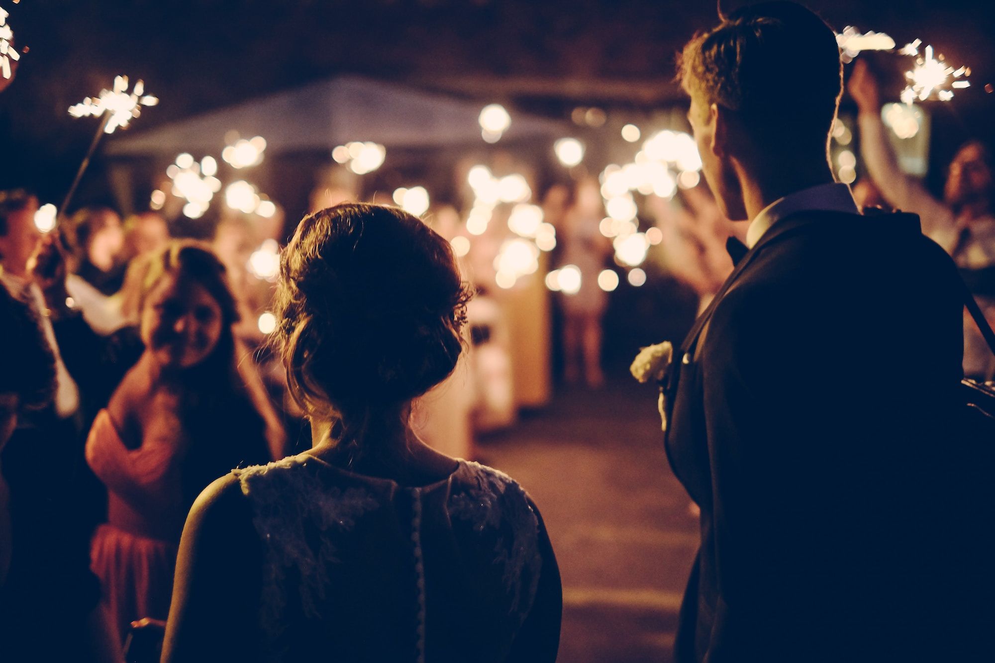 man-standing-near-the-woman-walking-in-party-during-nighttime-S2YssLw97l4.jpg