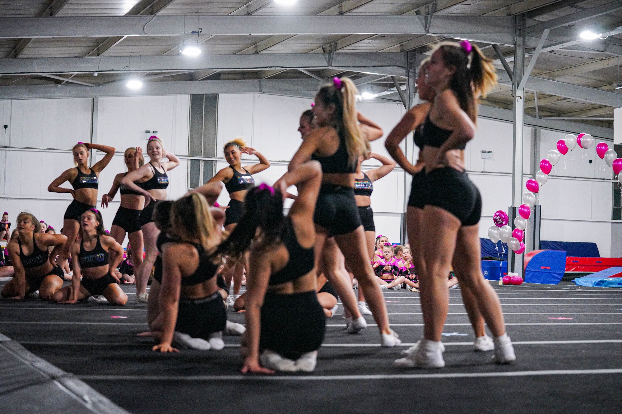 A group of girls rehearsing a cheer performance