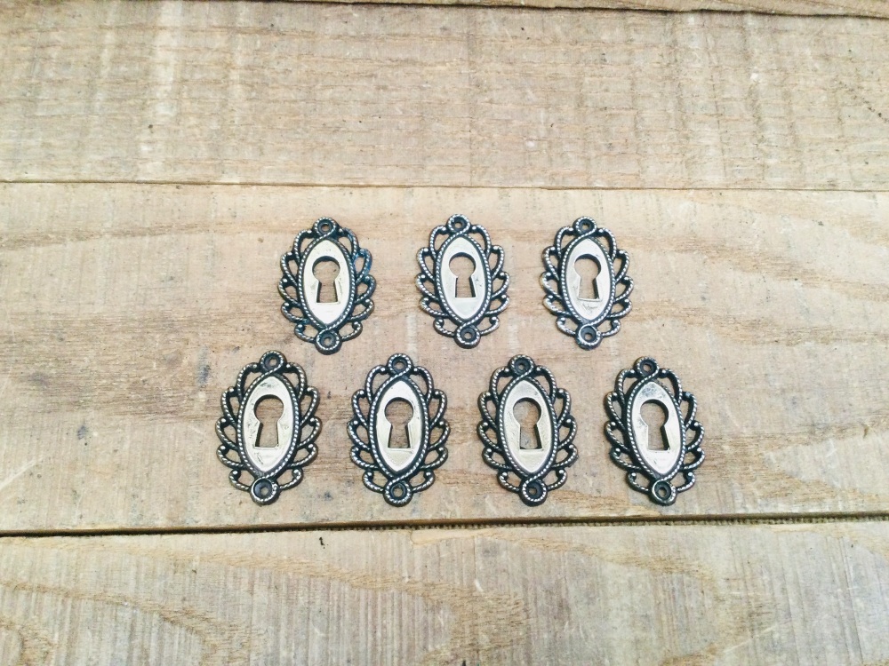 Seven Vintage Decorative Dresser Drawer Brass Keyhole Escutcheons