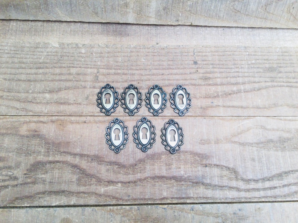 Seven Antique Decorative Dresser Drawer Brass Keyhole Escutcheons