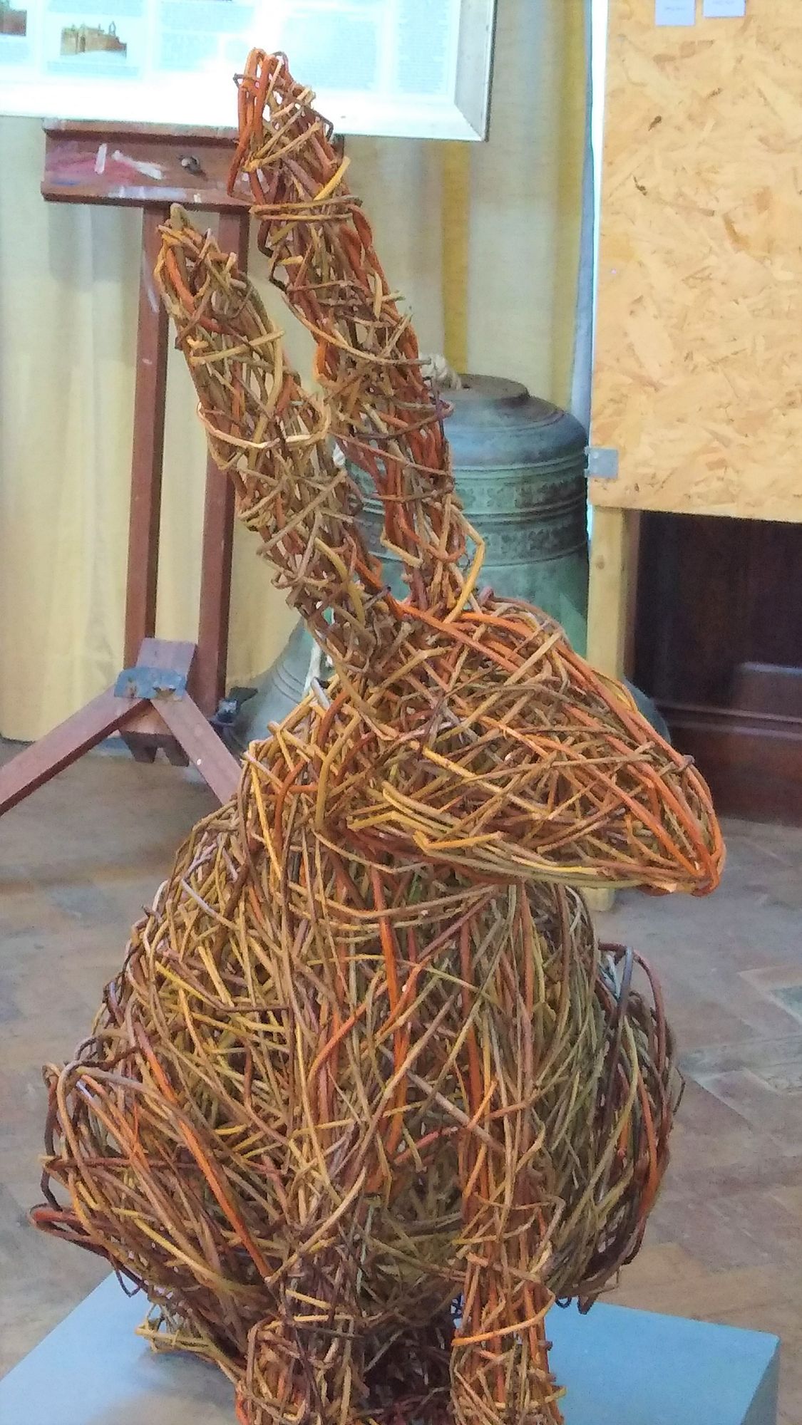 willow hare willow sculpture sitting on plinth