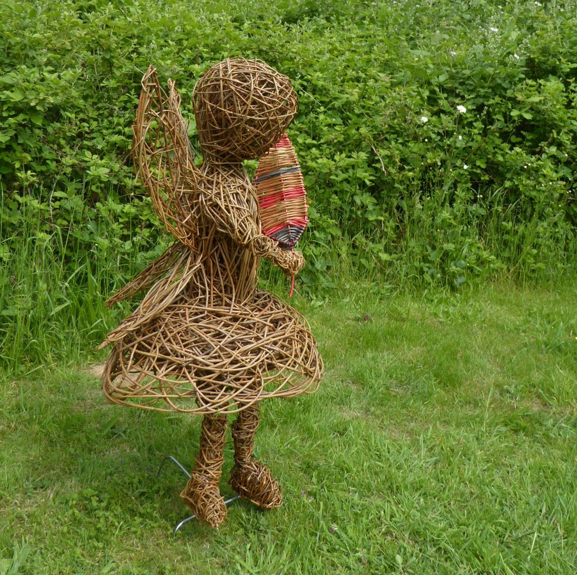 willow fairy sculpture with leaf side view 