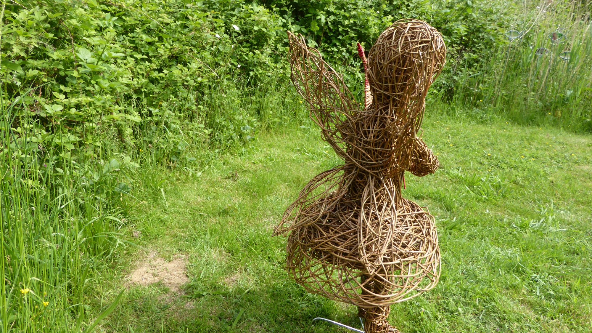 willow fairy sculpture with leaf side view 