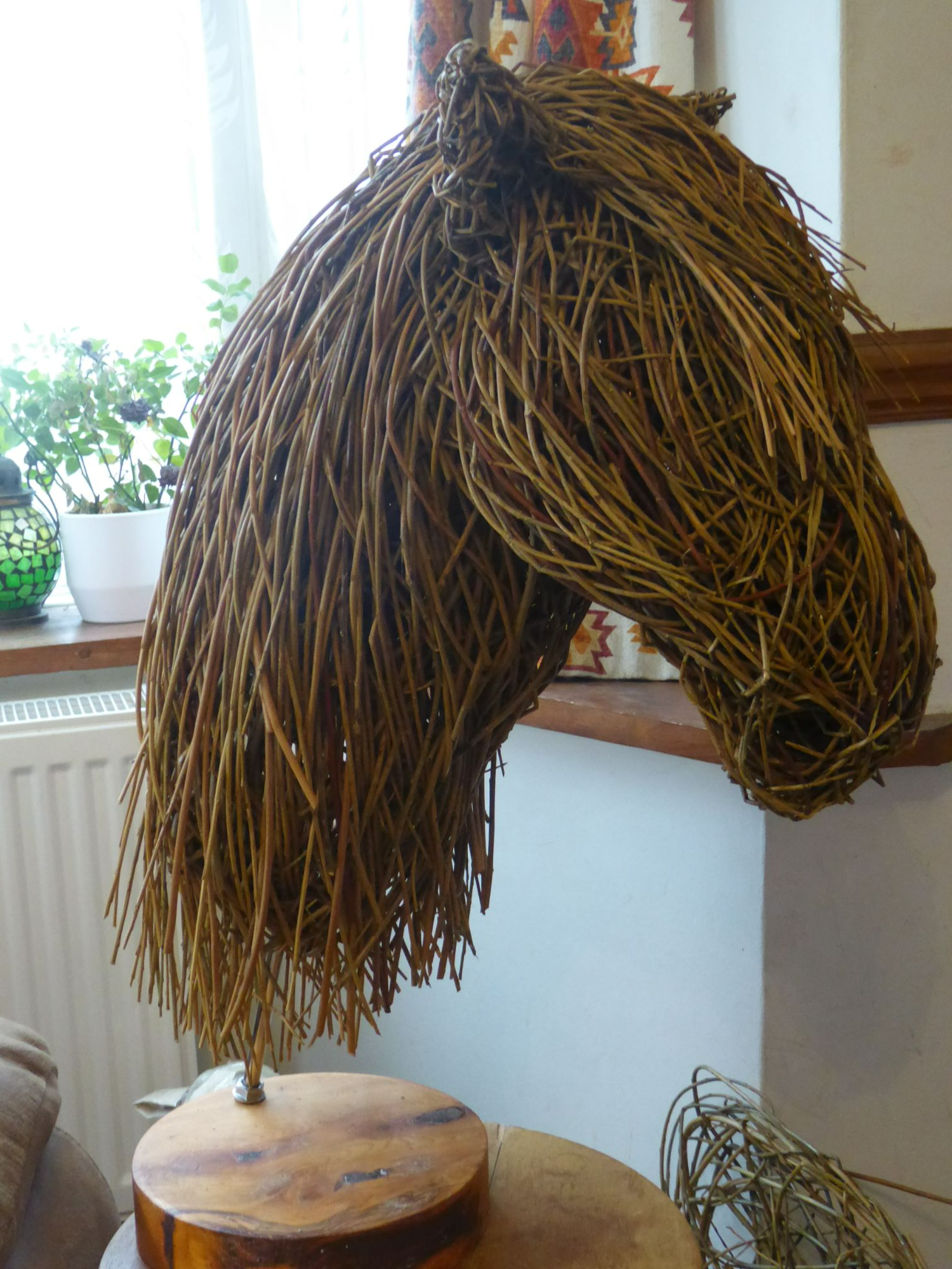 Willow pony head on a wooden plintth