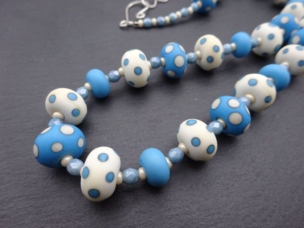 ivory and blue polka dots