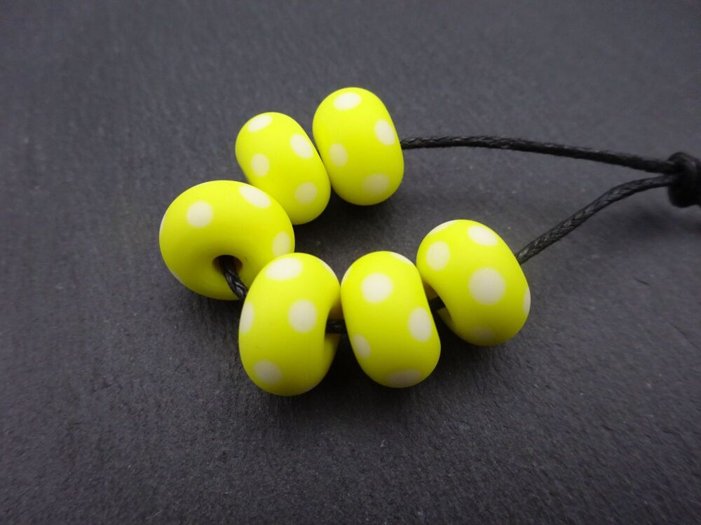 yellow and white polka dot tumbled