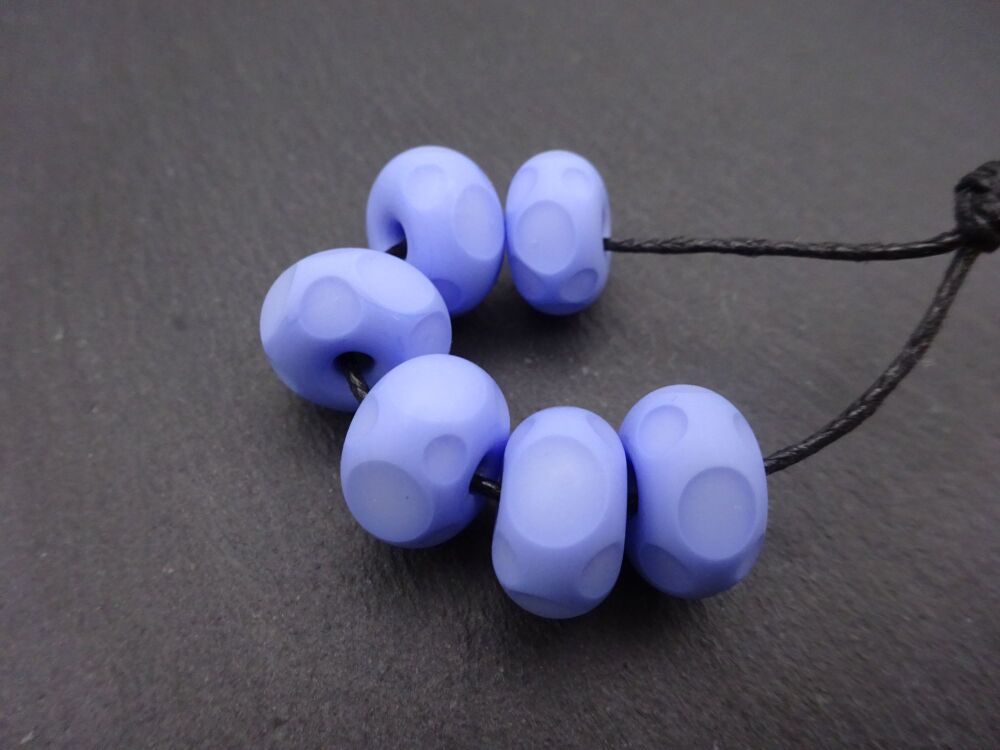 Blue tumbled spots