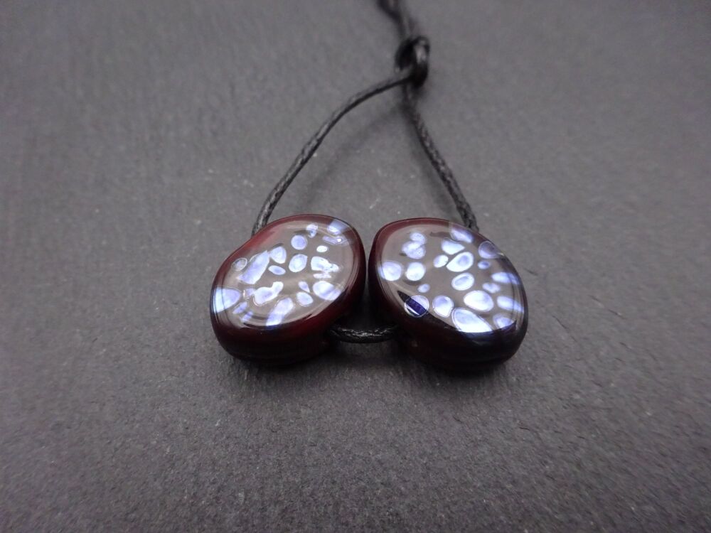 dark red and silver ovals
