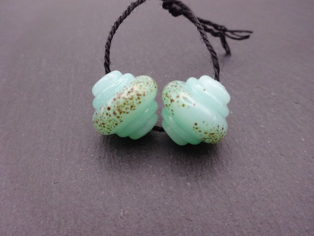 aqua green ornate speckles