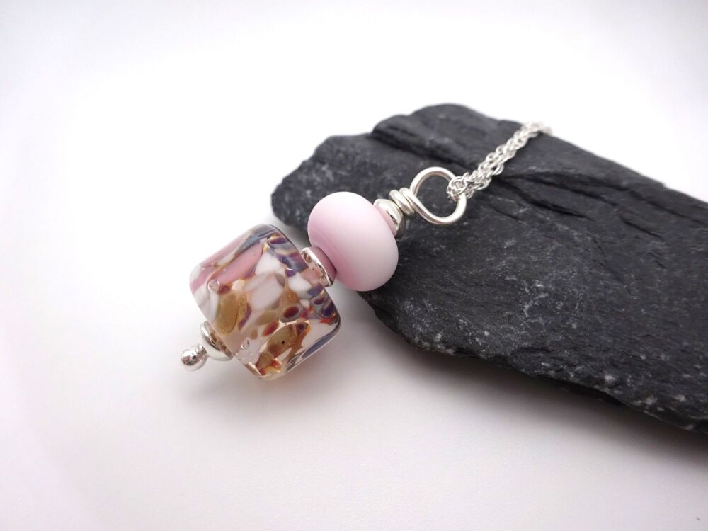 pink and brown pendant